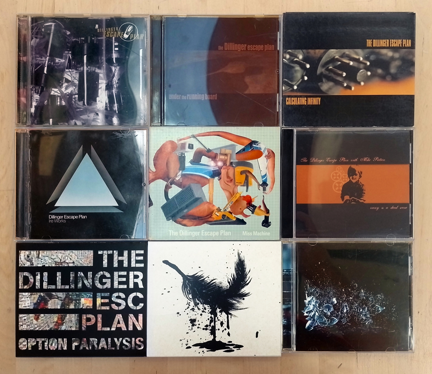 9 CDs by The Dillinger Escape Plan laid out in a 3x3 grid