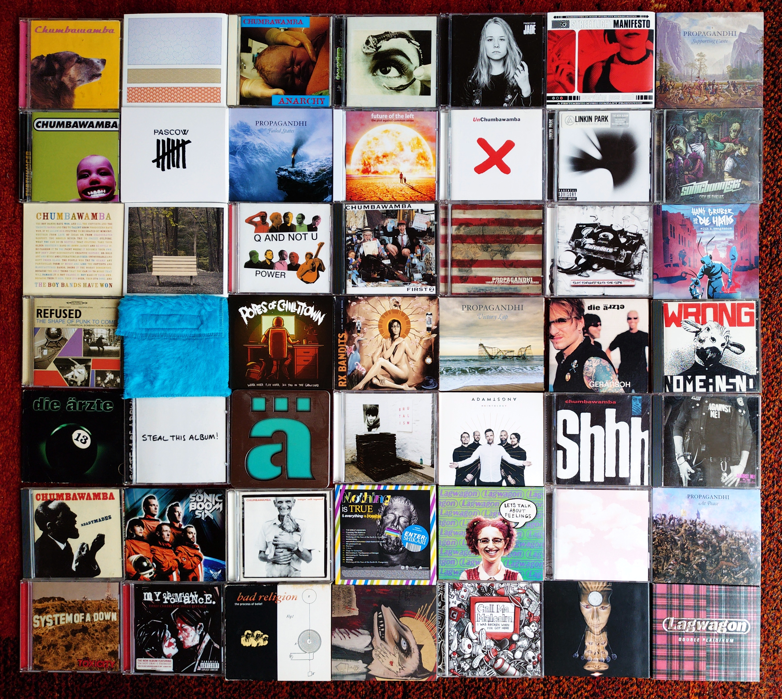 49 CD albums laid out in a 7x7 grid. The albums are listed below on the page