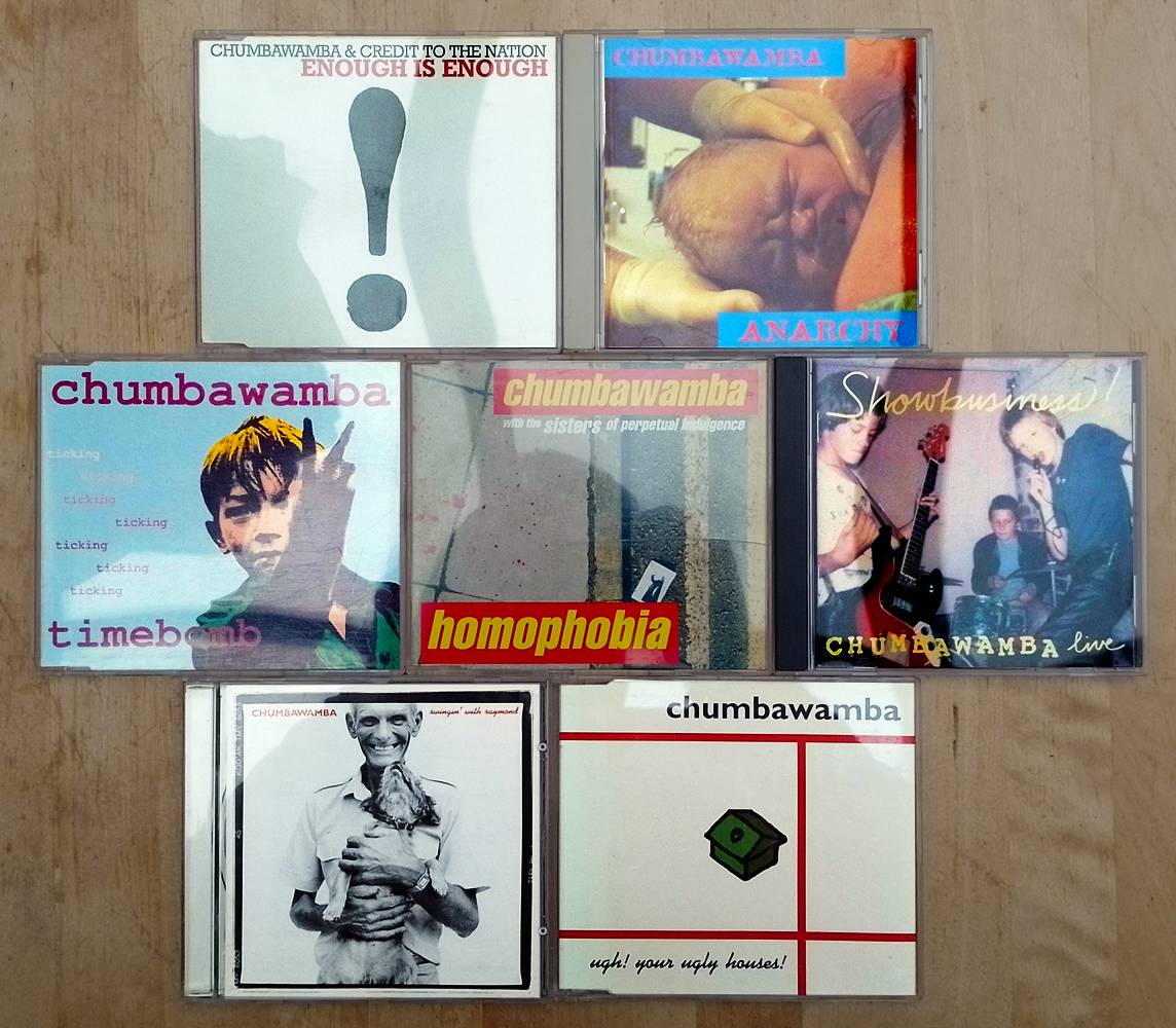 7 CDs by Chumbawamba: Enough Is Enough, Anarchy, Timebomb, Homophobia, Showbusiness!, Swingin' with Raymong, and Ugh! Your Ugly Houses!