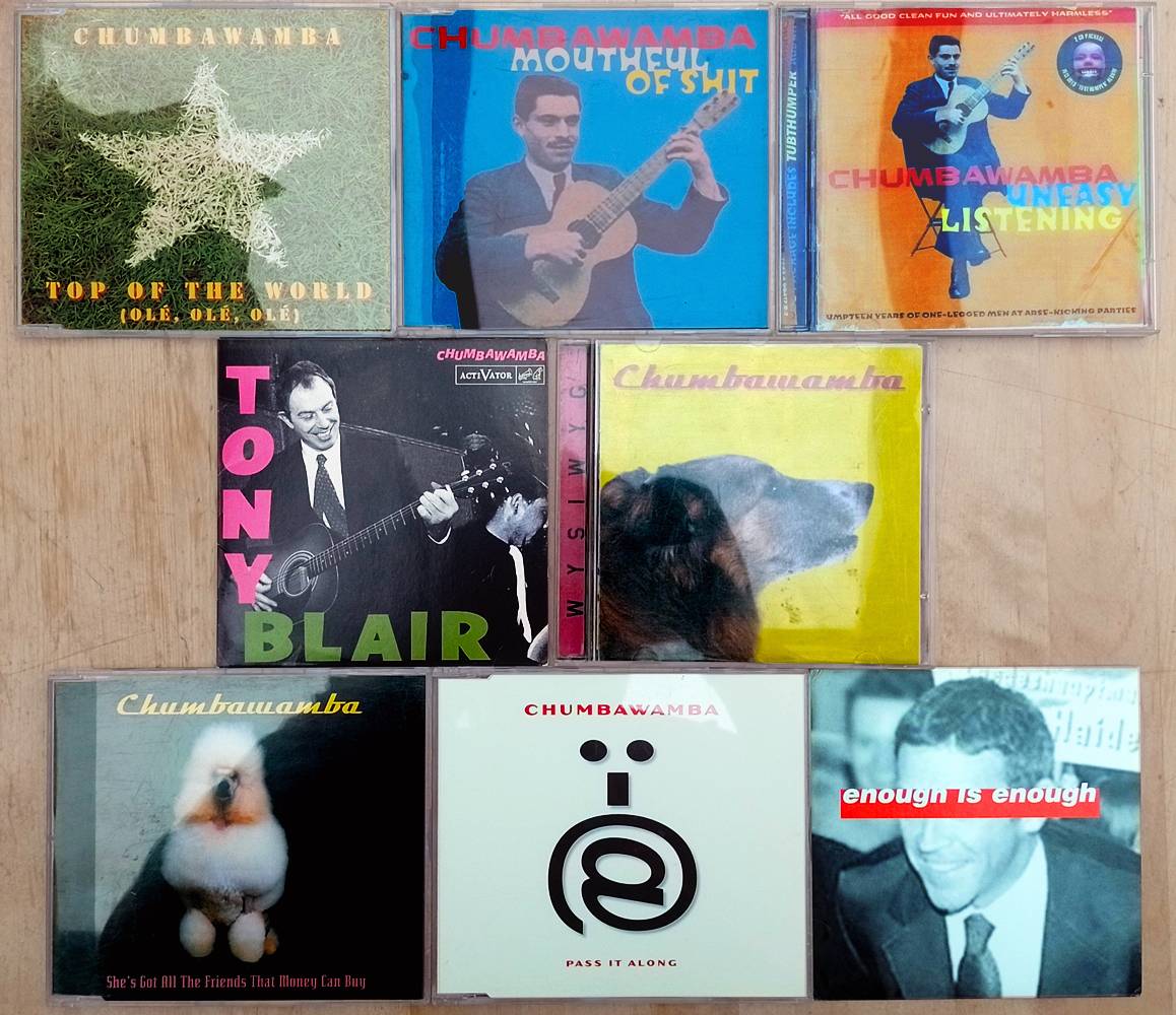 8 CDs by Chumbawamba: Top of the World (Ole, Ole, Ole), Mouthful of Shit, Uneasy Listening, Tony Blair, WYSIWYG, She's Got All the Friends That Money Can Buy, Pass It Along, Enough Is Enough (Kick It Over)