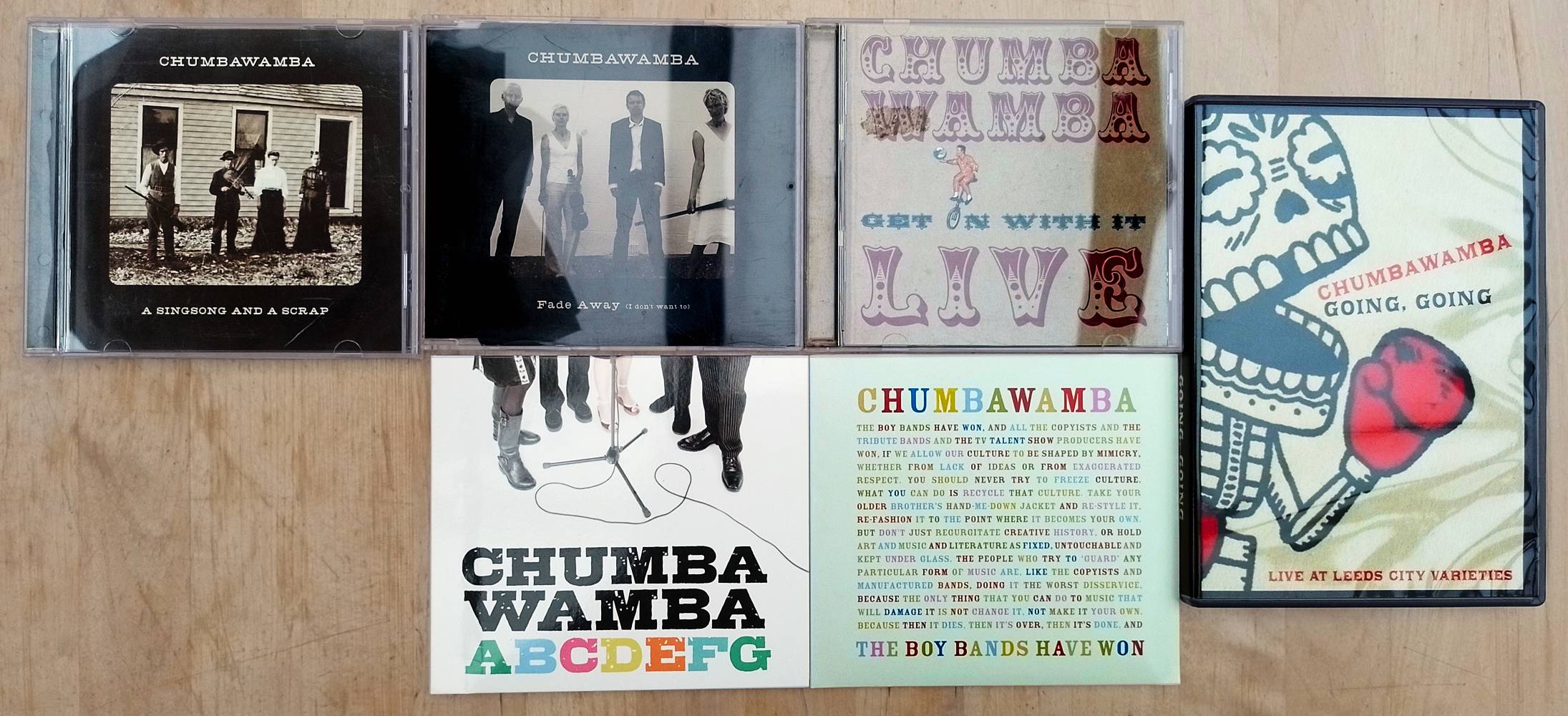 5 CDs by Chumbawamba: A Singsong and a Scrap, Fade Away (I don't want to), Get on with it, ABCDEFG, The Boy Bands Have Won, and the DVD Going Going