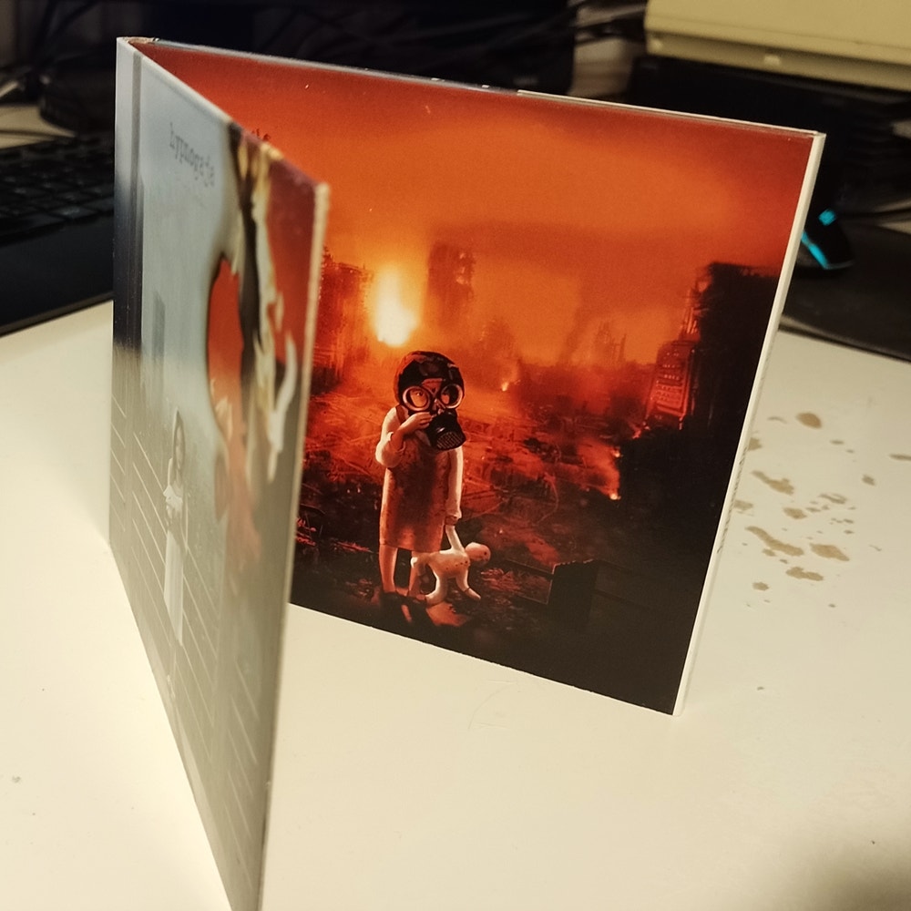 The Truth Decay digi pack, but opened up further revealing the artwork on the inside