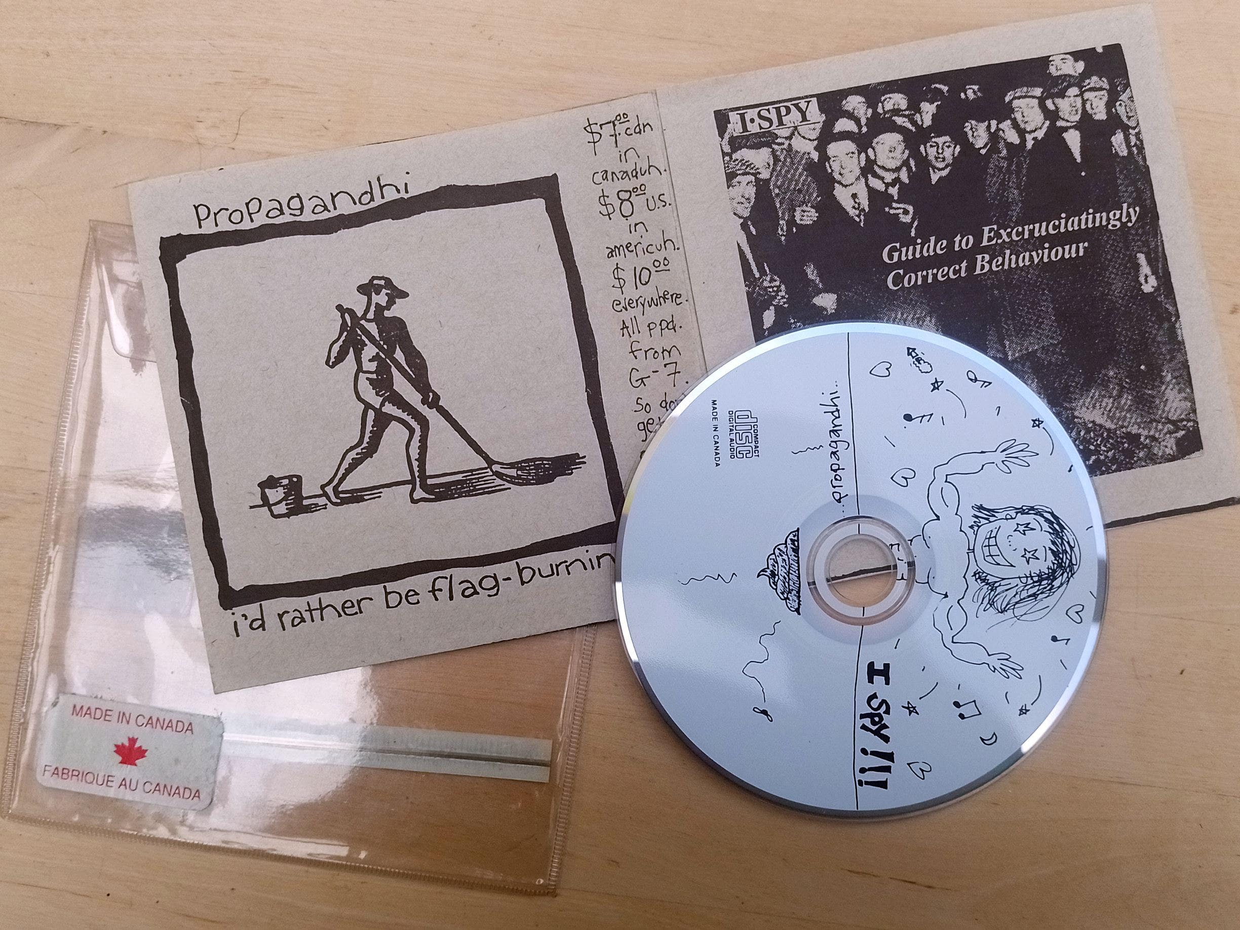 photo of a copy of the Propagandhi / I Spy split album 'I'd Rather Be Flag-Burning' / 'Guide to Excrutiatingly Correct Behaviour'