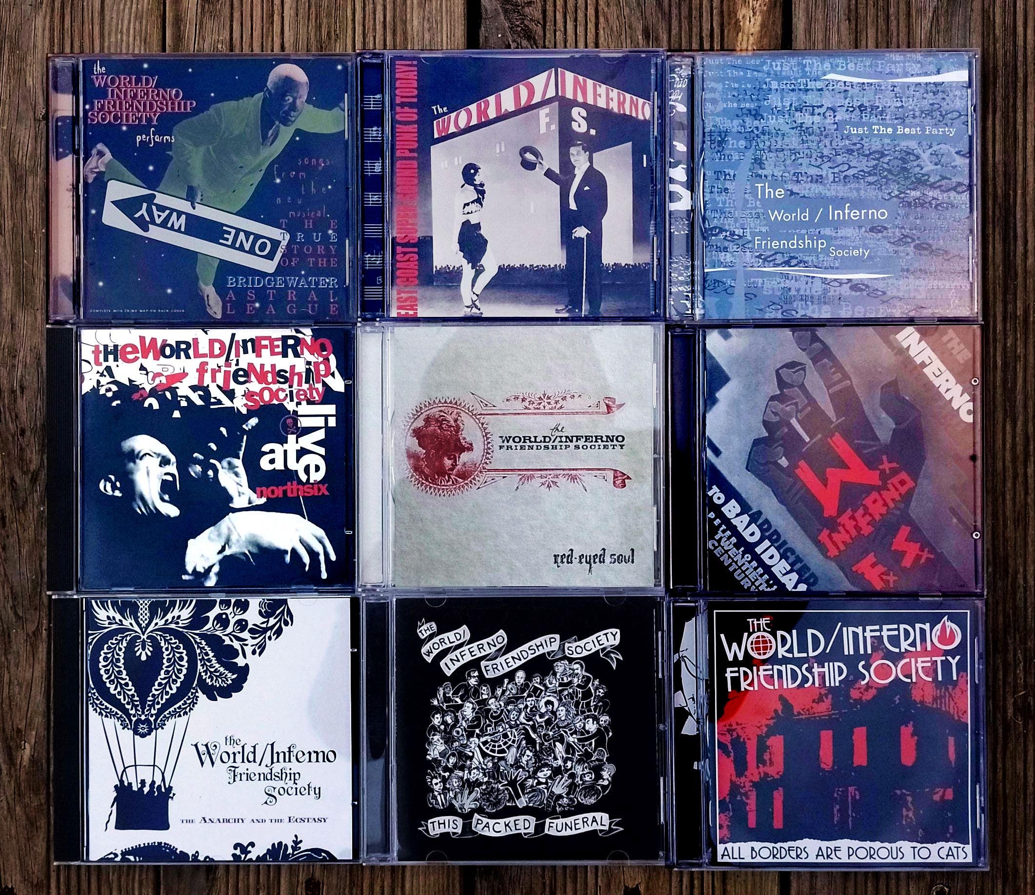 9 CDs by The World/Inferno Friendship Society laid out in a grid